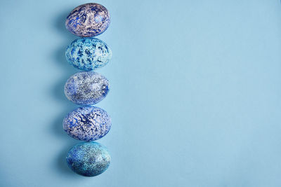 Close-up of crystal ball on blue table