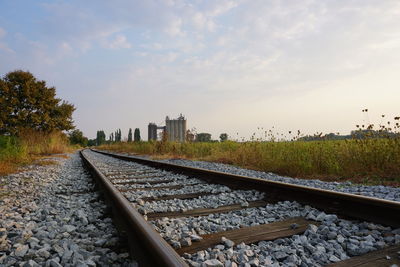 Surface level of railroad tracks against sky