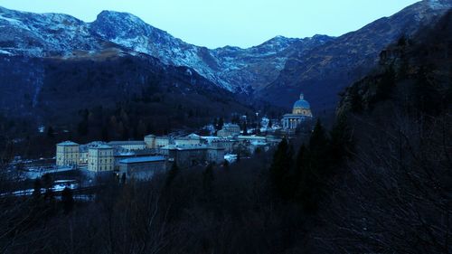 Scenic view of village against mountains