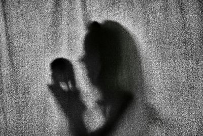 Shadow of man on wall