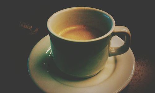 Close-up of coffee cup on table