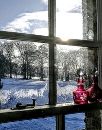 Close-up of snow on window during winter