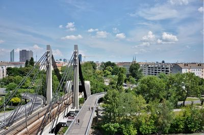 High angle view of bridge and buildings against sky