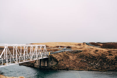 Bridge over river against sky