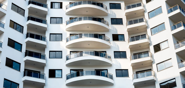 Residential building front view. facade of an apartment building. abstract architecture.