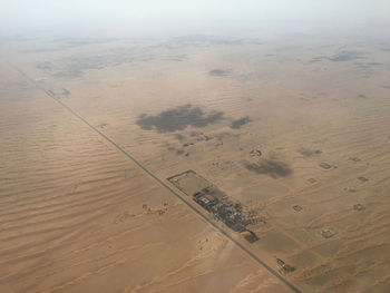 High angle view of sand dunes against sky