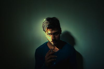 Portrait of young man against white background