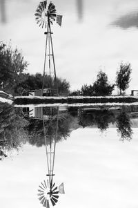 Reflection of trees in lake against sky