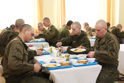 Group of people sitting on table