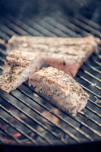 High angle view of meat on barbecue grill