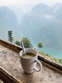 Ginger lemon tea with a view to nho que river