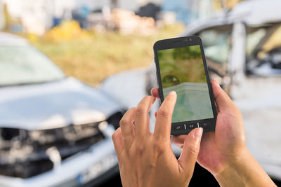 Man photographing through smart phone