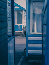 Blue wooden beach huts on the suffolk coast with vintage film filter