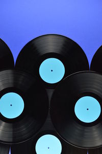 Close-up of records against blue background