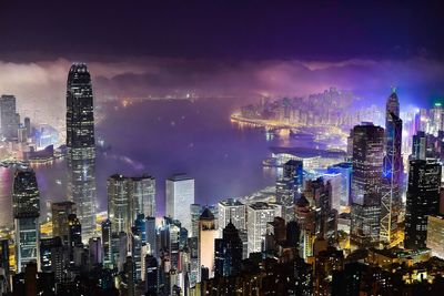 Aerial view of city lit up at night