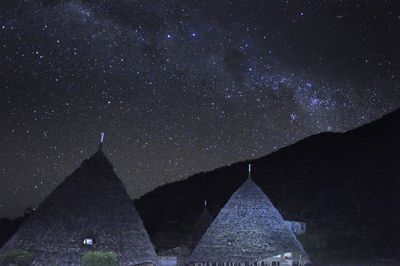 Low angle view of building against sky at night