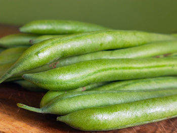 Close-up of green chili peppers on table