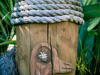 Rope tied around wooden post