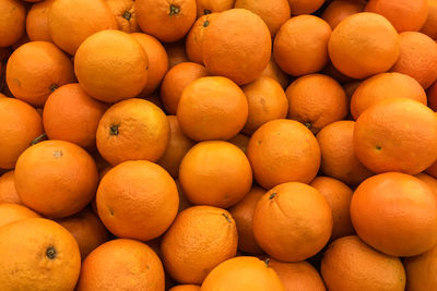 Full frame shot of oranges at market stall