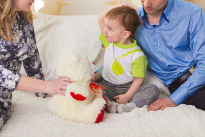 High angle view of people with toy