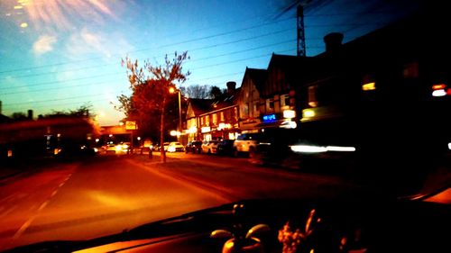 Cars on road in city at night