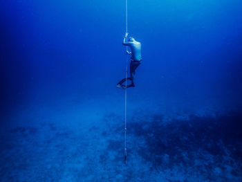 Man free diving in sea