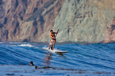 Man surfing in sea