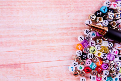 Directly above shot of pen and letters on table