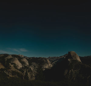 Scenic view of mountains against sky at night