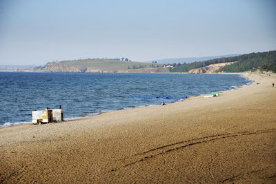 Scenic view of beach against clear sky