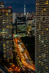 High angle view of illuminated buildings in city at night