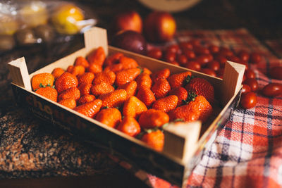 Close-up of strawberries in box on table