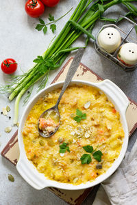 Homemade baked casserole crumble with red fish, white bread and cheese. 