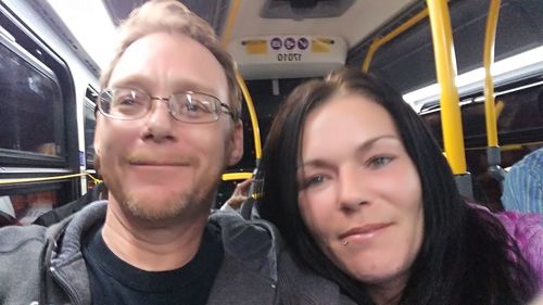 Portrait of young man sitting in train