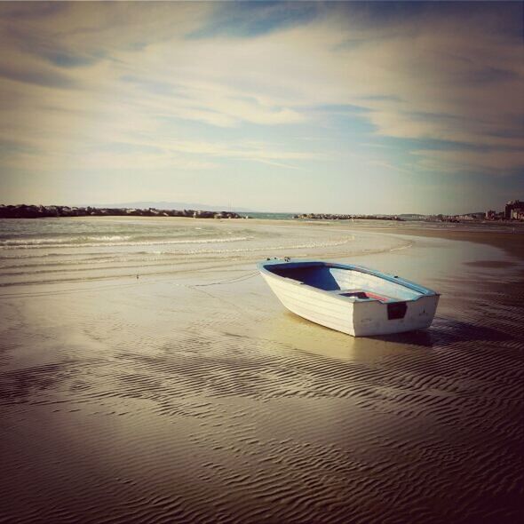 water, sky, sea, tranquil scene, beach, tranquility, sand, cloud - sky, scenics, nature, beauty in nature, nautical vessel, shore, transportation, cloud, boat, outdoors, horizon over water, reflection, idyllic