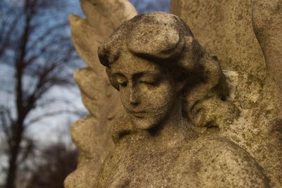 Close-up of angel statue in cemetery