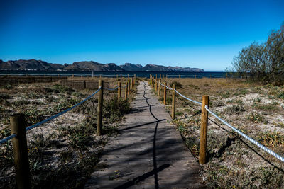 Scenic view of landscape against clear blue sky