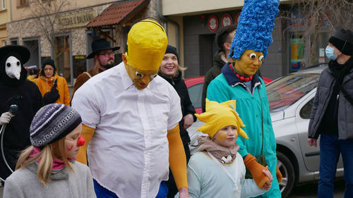 People standing on street in city