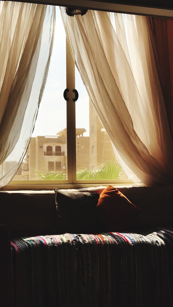 curtain, window, indoors, textile, furniture, no people, bed, day, hanging, home interior, domestic room, bedroom, sunlight, pillow, stack, linen, close-up, nature, publication