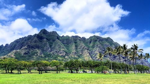 Scenic view of mountains against cloudy sky