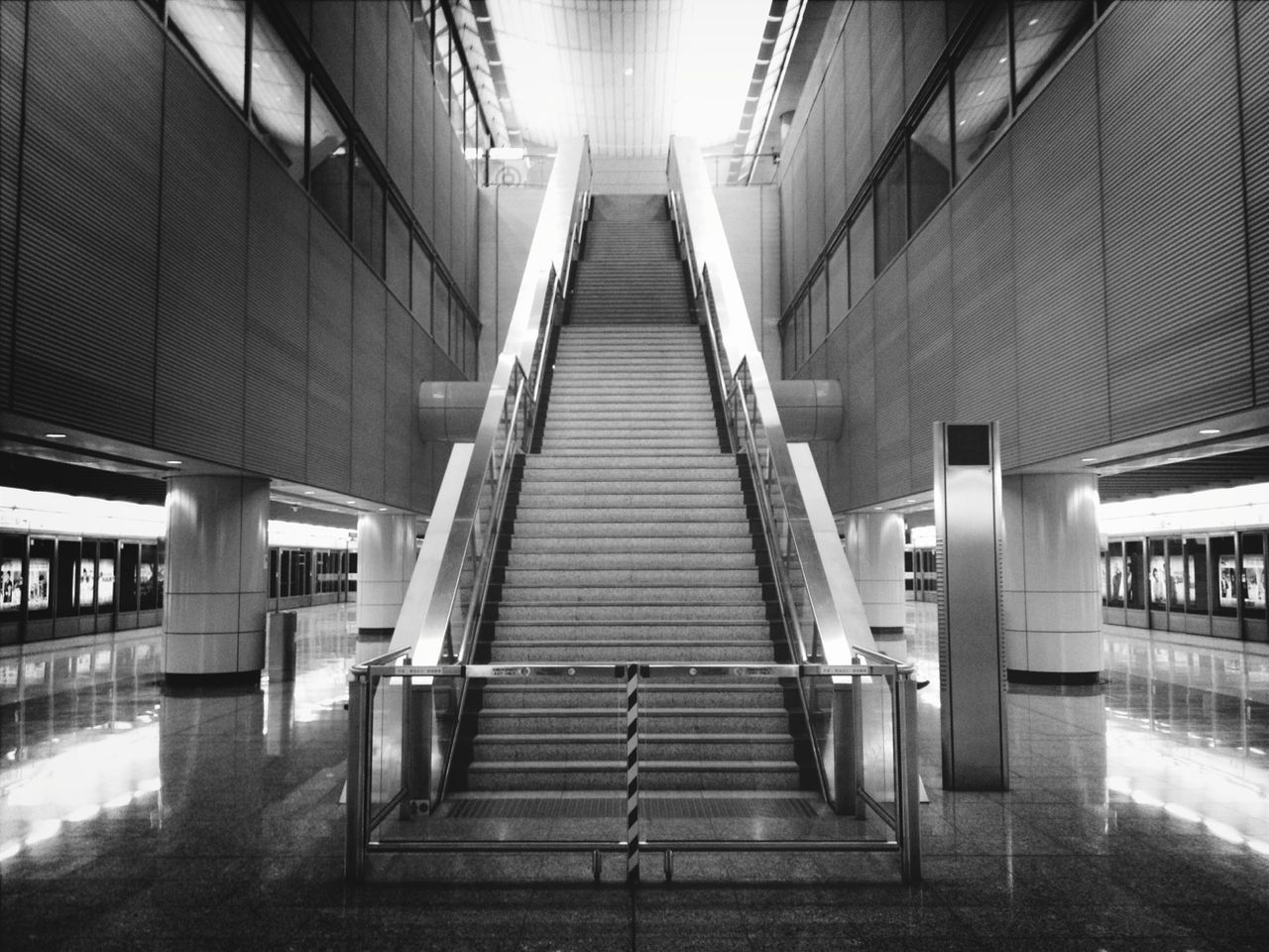 architecture, built structure, indoors, steps, building exterior, railing, the way forward, staircase, steps and staircases, architectural column, building, diminishing perspective, low angle view, modern, corridor, no people, column, ceiling, empty, day