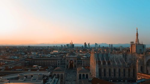 High angle view of city buildings during sunset