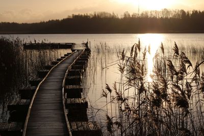 Scenic view of lake against sky during sunset