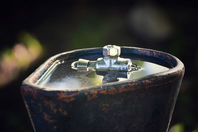 High angle view of wedding rings on metal container