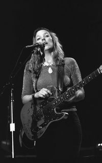 Young woman playing guitar