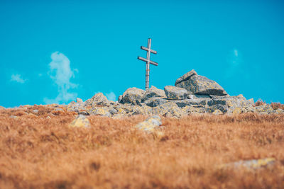 Low angle view of rocks on land against sky