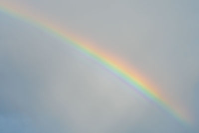 Low angle view of rainbow against sky