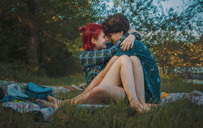 Young couple sitting on land