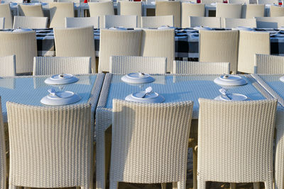 Row of hooded chairs on beach