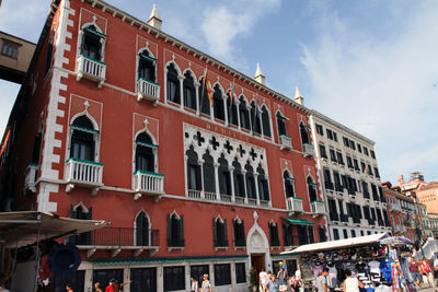 Low angle view of buildings in city against sky